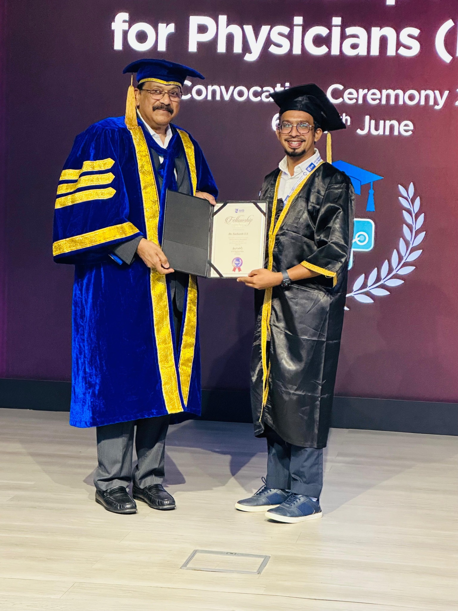 Doctor receiving an AIG fellowship certificate during the convocation